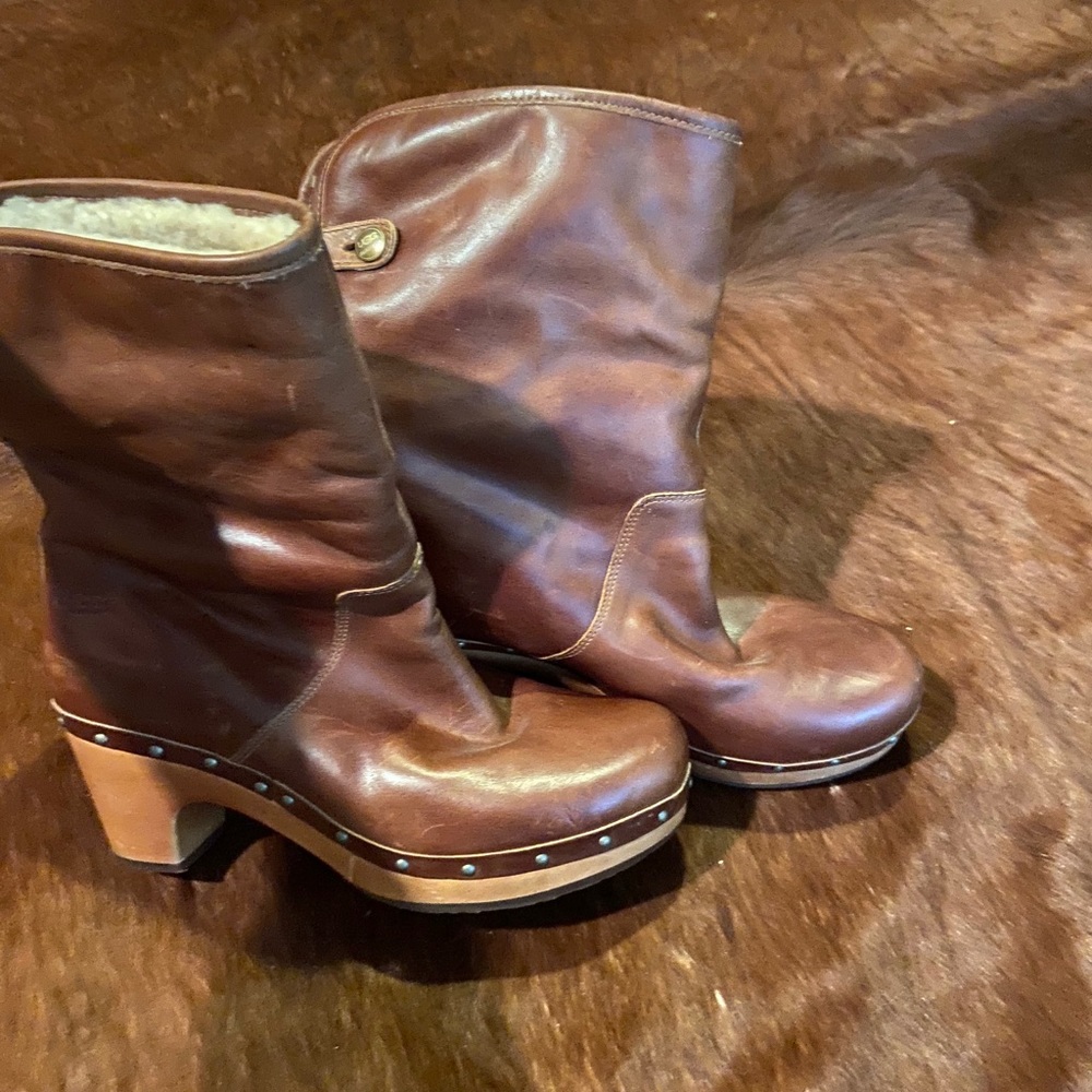 UGG fur-lined leather boots with a wooded sole